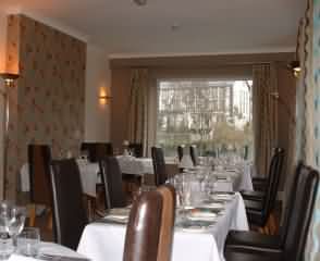 The comfortable and well appointed dining room directly overlooks the River Irfon